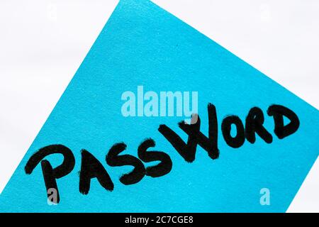 Password handwriting text close up isolated on blue paper with copy space. Writing text on memo post reminder Stock Photo