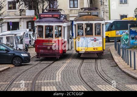Lisbon, Portugal - December 20, 2019: Trams at Largo das Portas do Sol, Lisbon, Portugal. Stock Photo
