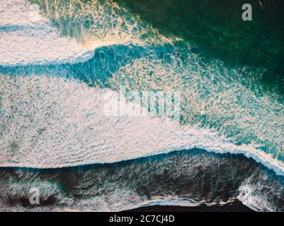 Aerial view of stormy waves in ocean. Biggest ocean wave with foam. Top view. Stock Photo