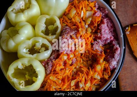 Bowl of raw minced meat and sauteed vegetables for stuffed bell peppers. Vegetables completely ready for filling with meat. Cooking dinner. Part from Stock Photo