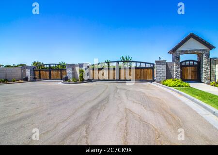 Entrance/Exit Wooden Automatic Gates With Pedestrian Entry Stock Photo