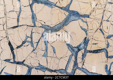 old cream orange peeling paint on the wall texture. Stock Photo