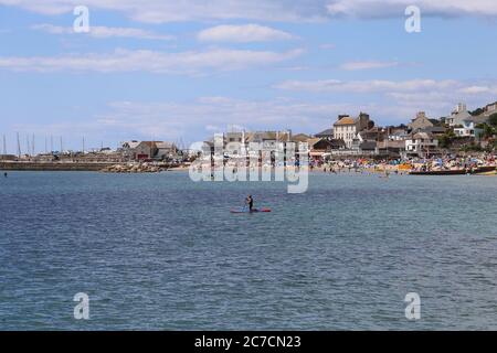 Paddle-boarder, Lyme Regis, Dorset, England, Great Britain, United Kingdom, UK, Europe