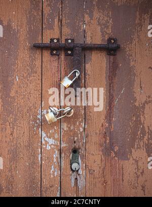 Lock on a wooden door.  Lighthouse entrance at Port d Andratx. Popular historical building with museum. Stock Photo