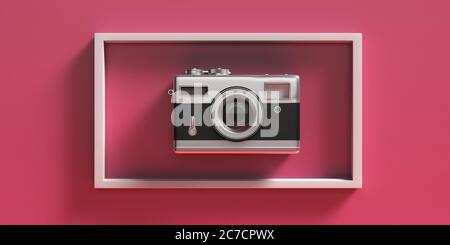 Photo camera vintage style. Retro old fashioned camera in a white picture frame, pink fuchsia color background. 3d illustration Stock Photo
