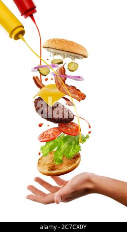 Man cooking a cheeseburger. Creative concept, isolated on white background Stock Photo