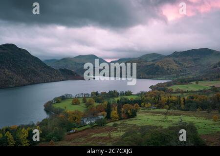 Autumnal evening view over Ullswater and Aira Point from Gowbarrow Fell in the Lake District National Park, Cumbria, England.