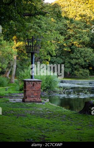 Boultham Park, Lincoln, Originally the park for the Boultham Hall, opened as a public park for the people of Lincoln, Park beacon, Beacon beside lake. Stock Photo