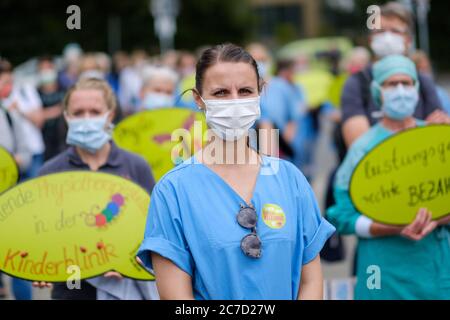 Hanover, Germany. 16th July, 2020. Nurse Saskia stands in front of the Lower Saxony State Chancellery during a rally of employees of the Hannover Medical School (MHH). The employees of the MHH demanded better working conditions. Credit: Ole Spata/dpa/Alamy Live News Stock Photo