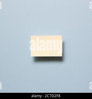 Yellow memo paper, sticky notes on blue background. top view, copy space Stock Photo