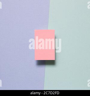 Pink memo paper, sticky notes on purple and green background. top view, copy space Stock Photo