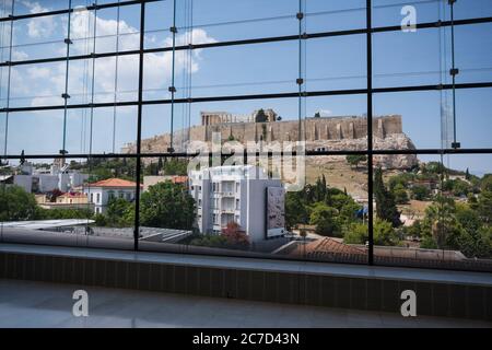 The historic Acropolis in Athens Greece seen through the modern windows of the Acropolis Museum. Stock Photo