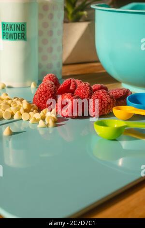 Home Baking Ingredients and Equipment in a Bright Sunny Kitchen Stock Photo