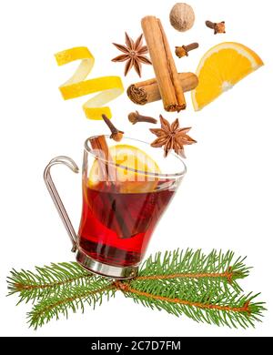 spices falling into a glass of mulled wine isolated on white Stock Photo
