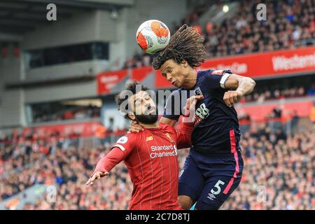 Nathan Ake of Bournemouth wins the battle for the ball with Mohamed Salah (11) of Liverpool Stock Photo