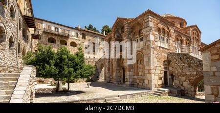 The historic Loukas Monastery in Greece with its beautiful churches and buildings built of warm tinted stones in summer. Stock Photo