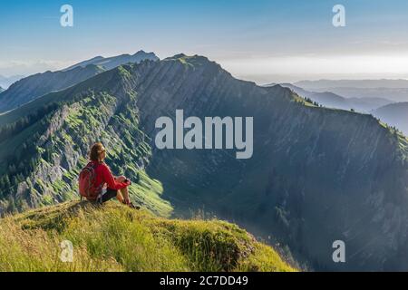 allgaeu alps, mountains, hiking, senior woman, walking, solitude, joyful, mountain running, enjoying life, running, vorarlberg, copy space, background Stock Photo