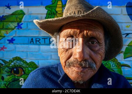 Old man and Wall street art graffiti in Concepción de Ataco Ahuachapán department El Salvador Central America. Ruta De Las Flores, Department Of Ahuac Stock Photo