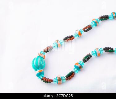 Multi-colour turquoise bead necklace isolated on white Stock Photo