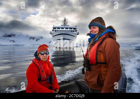 Exploring with Zodiac Wilhelmina Bay landscape at sunrice at Antarctica, Polar Regions Seventh continent. The RCGS Resolute One Ocean Navigator, a fiv Stock Photo