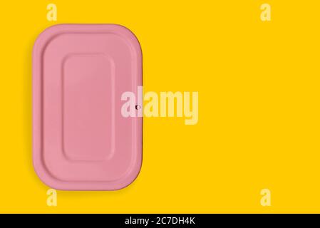 Pink food container on a colored background. Packaging for storing Breakfast, dinner or lunch. The concept of food delivery. Top view, copy space Stock Photo