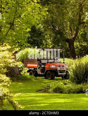 Kubota 4X4 utility vehicle in beautiful English garden with no people in view. July 19th 2020 - Diss, Norfolk, UK Stock Photo