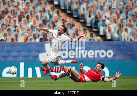 Leeds United's Patrick Bamford (left) and Barnsley's Michael Sollbauer battle for the ball during the Sky Bet Championship match at Elland Road, Leeds. Stock Photo