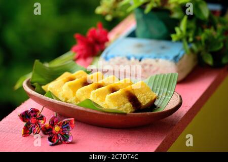 Brazilian cuisine. Creamy corn cake with rapadura honey. Stock Photo
