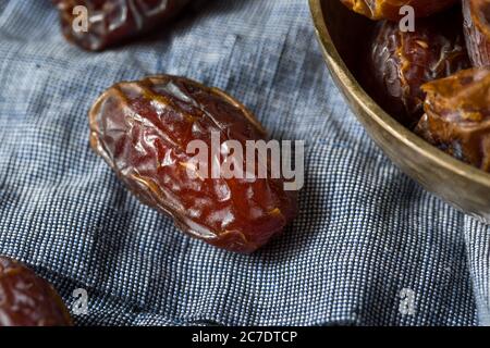 Organic Dry Red Dates in a Bowl Stock Photo