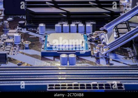 Close-up CPU Processor installed on socket of computer motherboard for work Stock Photo