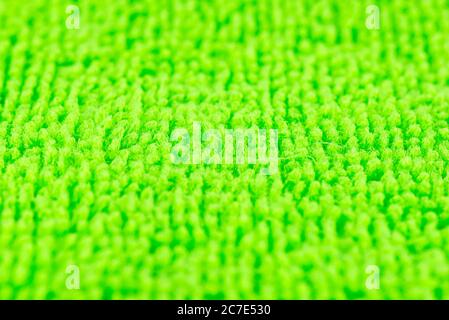 Background made of green microfiber fabric, selective focus. Stock Photo
