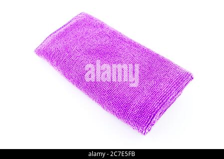 Purple microfiber fabric lying in the middle, isolated on a white background, top view. Stock Photo