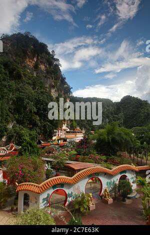 Vertical shot of a Chinese temple surrounded by Karst Mountains in Ipoh, Malaysia Stock Photo