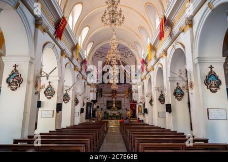 Pondicherry, India - February 2020: The benches and the arches inside the Immaculate Conception Cathedral in the city of Pondicherry Stock Photo