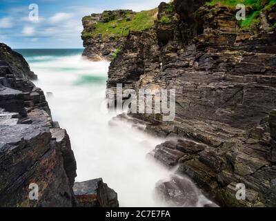 Rocky valley in Cornwall is the crossing point between many walks, and is halfway between the popular villages of Boscastle and Tintagel. Stock Photo