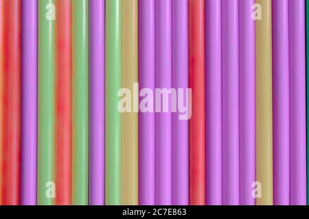 Colorful pastel plastic tubes straws background Stock Photo