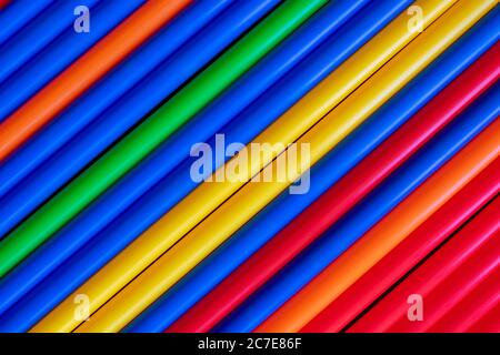 Colorful plastic tubes straws diagonal background Stock Photo