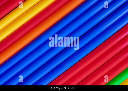 Colorful plastic tubes straws diagonal background Stock Photo