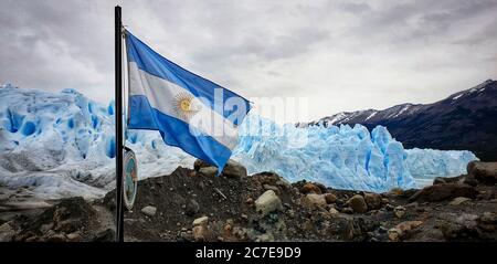 Argentia flag flying infront of the Perito Moreno glacier Stock Photo