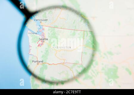 Los Angeles, California, USA - 15 March 2019: Washington, WA state of America visualization illustrative concept on display screen through magnifying Stock Photo