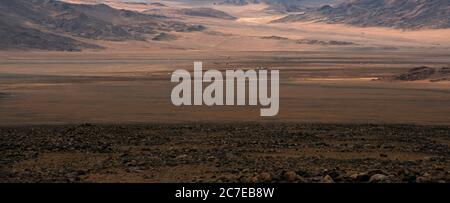 The vast wilderness of the Altai Mountains in western Mongolia is home to ethnic Kazakh nomads. Stock Photo