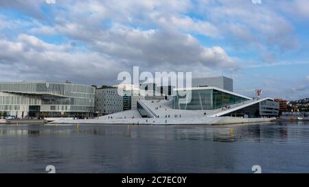 Oslo Opera House in Norway, cityscape view. Modern architecture exterior of the building with white granite and nice reflections on blue sunny sky wit Stock Photo