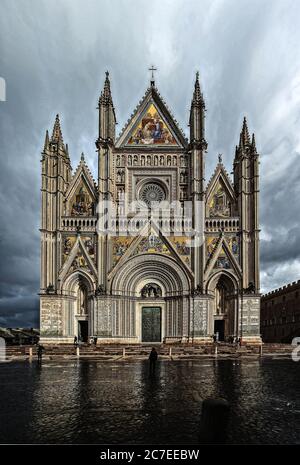 Vertical shot of the Orvieto Cathedral in Umbria, Italy near the lake under the breathtaking sky Stock Photo