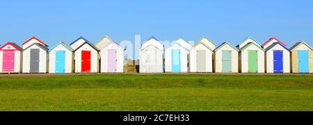 Row of beach huts in coastal town of Paignton, Devon Stock Photo