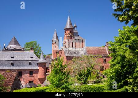 View to the historic red sandstone church building in famous red village Collonges-la-Rouge, Correze, Limousin, France, Europe. Stock Photo