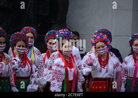 Coronavirus outbreak: Government prolongs adaptive quarantine until July 31 in Ukraine. Members of the Ukrainian choir in national costumes and embroi Stock Photo