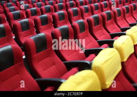 Horizontal shot of an empty cinema hall with red seats Stock Photo