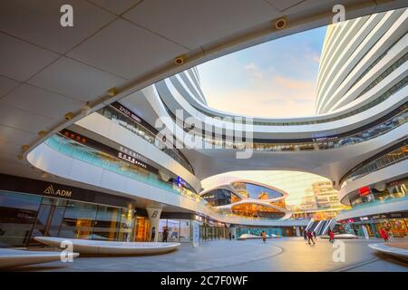 Beijing, China - Jan 12 2020: Galaxy Soho Building is an urban complex opened in 2014, designed by  architect Zaha Hadid. The complex offers shops, of Stock Photo