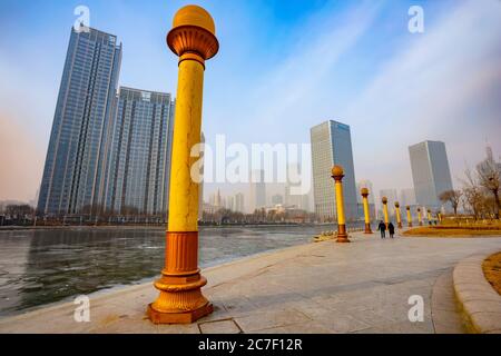 Tianjin, China - Jan 16 2020: Cityscape of Tianjin city with buiding and architecture on the side of Haihe river bank Stock Photo