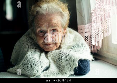 Portrait of an elderly beautiful wrinkled woman. Stock Photo